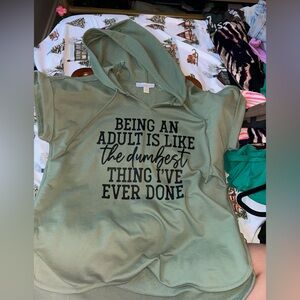 Green sweater that I love but I just can’t fit.